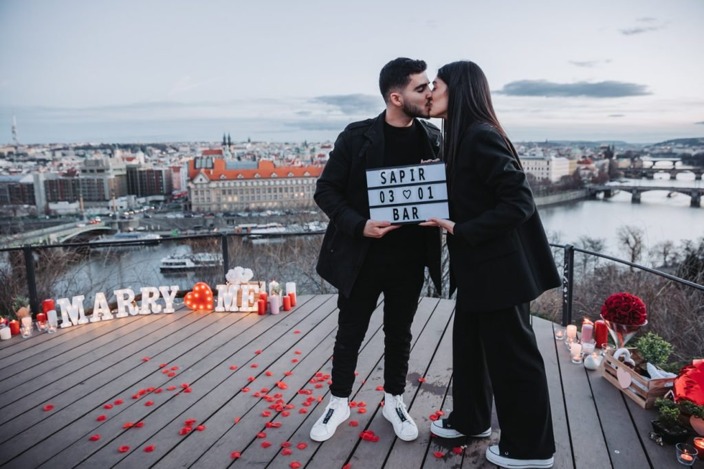 Surprise proposal on a Prague terrace overlooking the Vltava
