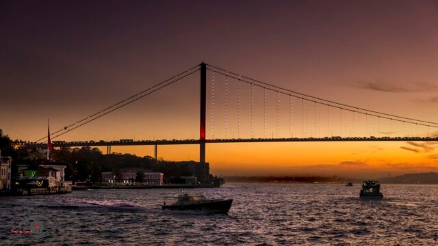 Bosphorus Bridge at sunset, Istanbul The Bosphorus Bridge silhouetted against an orange sunset over the water, Istanbul